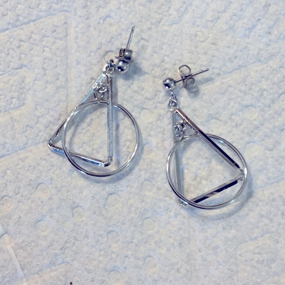 Silver plated dangle earrings that are about 1 1/2 inches and great condition.